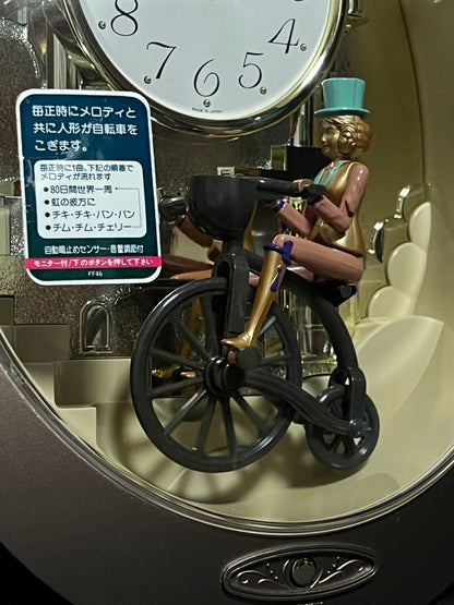 Rhythm "Small World Wind Story 3" Bicycle Magic Motion Musical Mantel Clock from Japan - 4RH716RH12