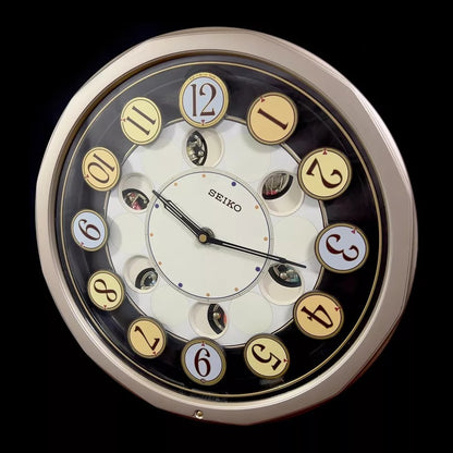 Seiko QXM106SRH "Twirling Numbers" Melodies in Motion Musical Wall Clock with Moving Dial