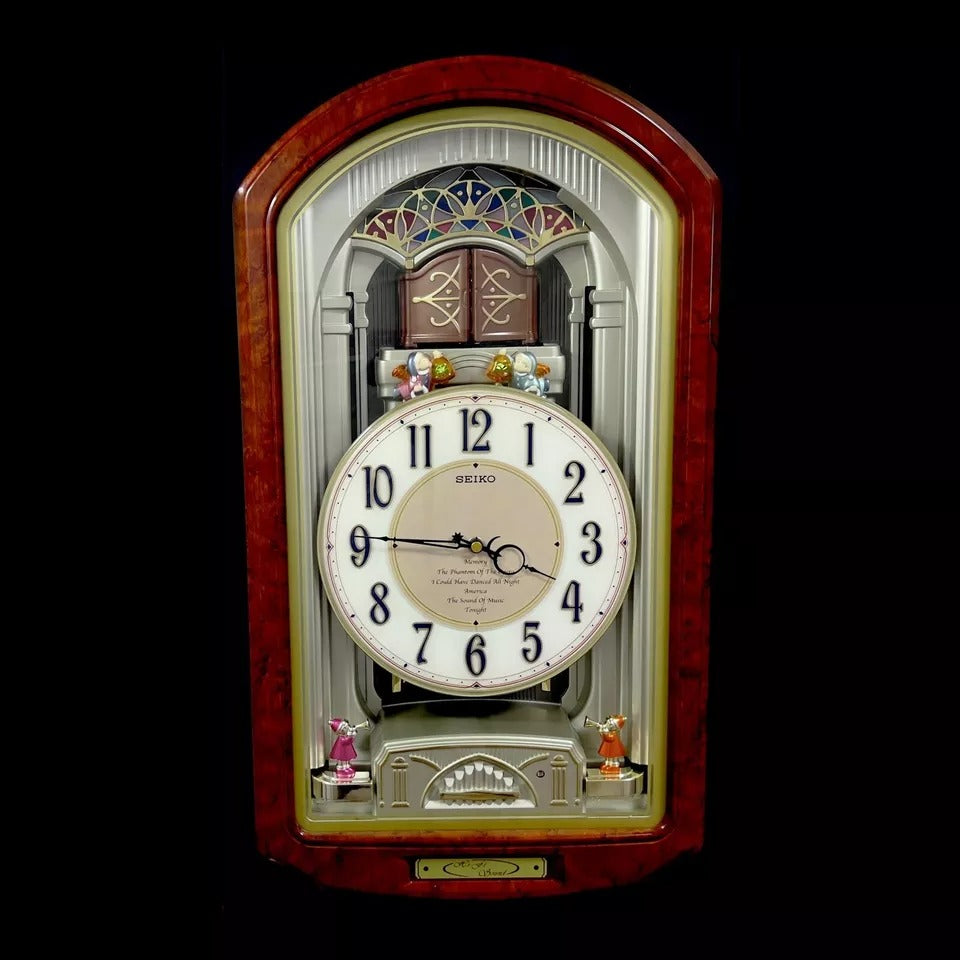 Seiko QXM123BRH "Broadway Showtunes Dropping Dial" Melodies in Motion Musical Moving Wall Clock